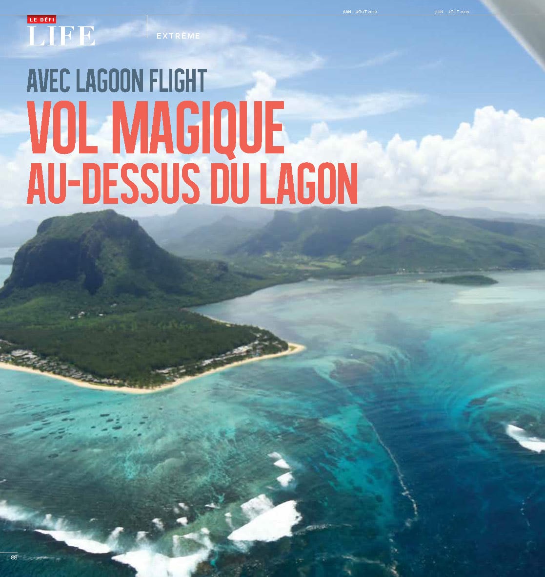 Aerial view of a blue lagoon, mountainous island, beach, and promotional text for a lagoon flight.